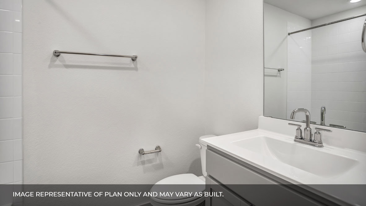 Bathroom with single sink white vanity and white granite tops.