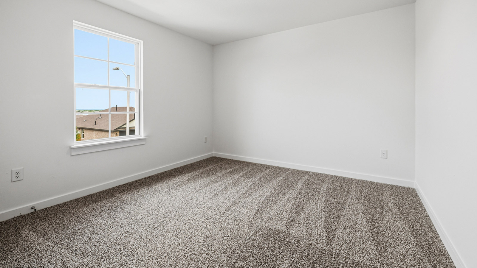 Bedroom 3 with carpeted flooring.