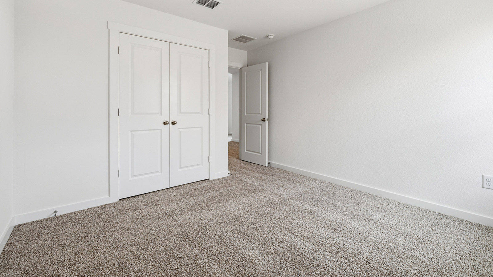 Bedroom 4 with carpeted flooring.