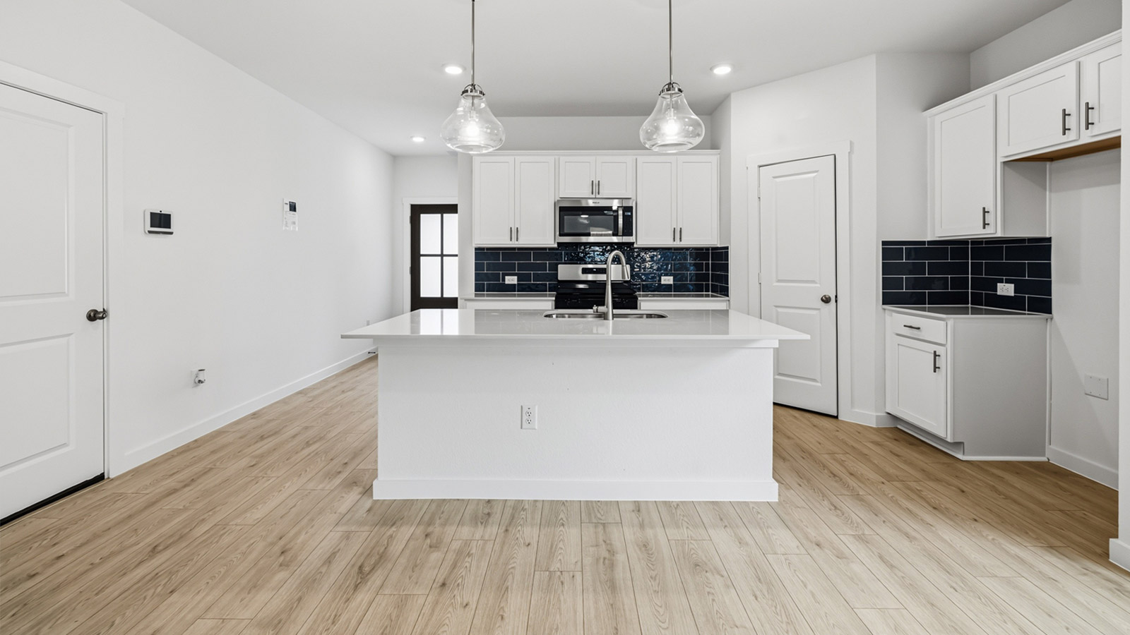 Open kitchen and living area with kitchen island.