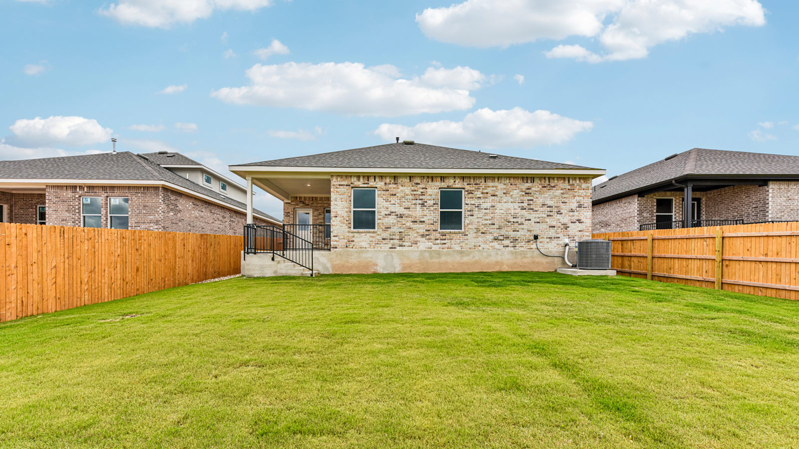 Large backyard of 1913 Lazy Acres Street in Leander, TX.