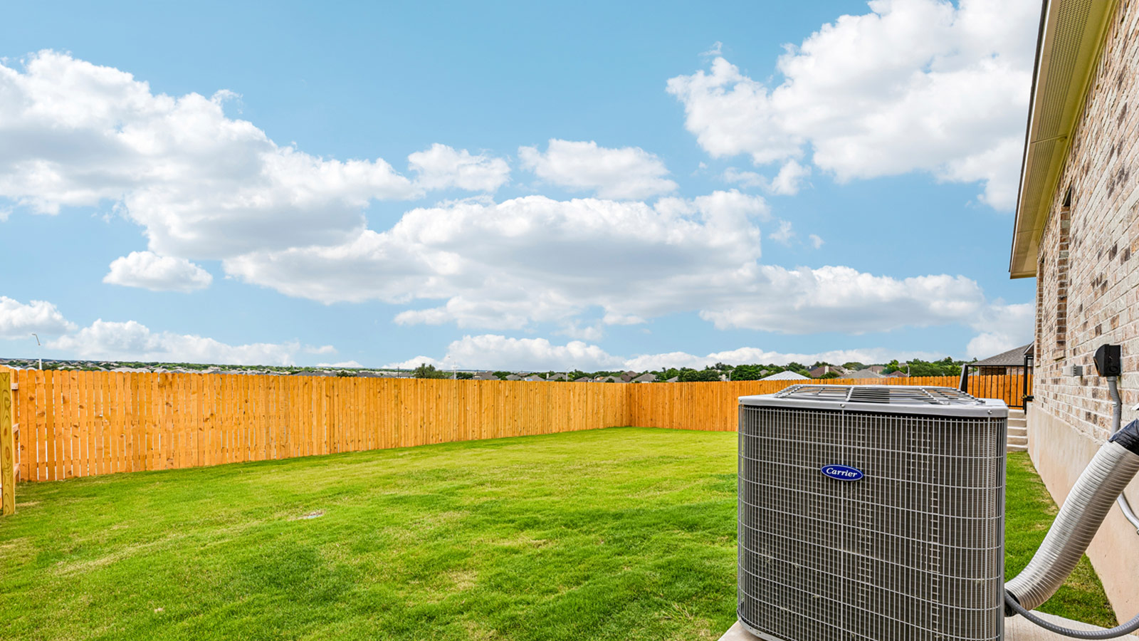 Large backyard of 1913 Lazy Acres Street in Leander, TX.