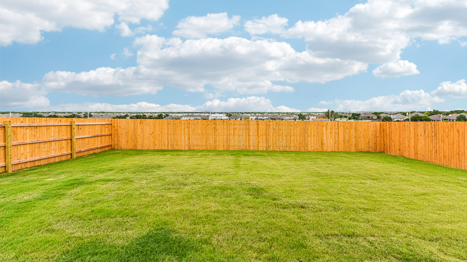 Large backyard of 1913 Lazy Acres Street in Leander, TX.