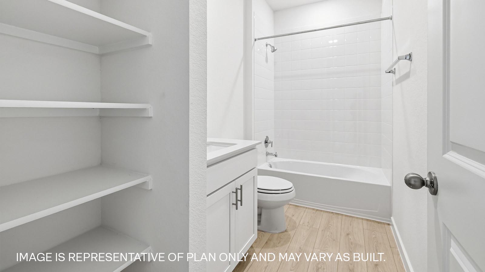 Secondary bathroom with storage shelves.