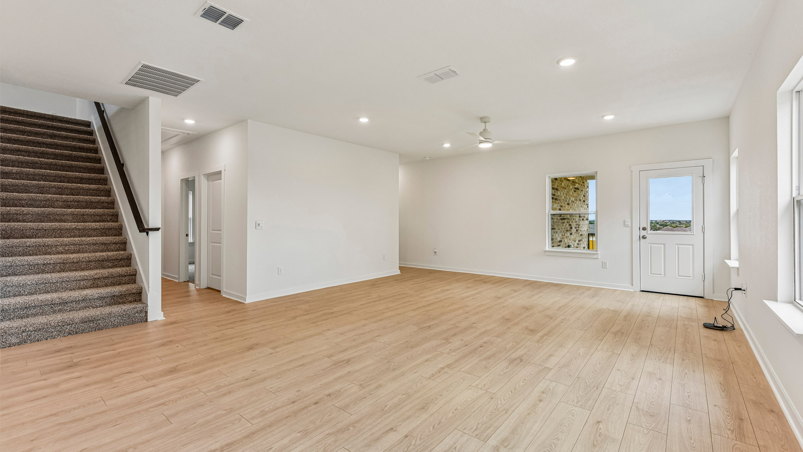 Quincy Open Concept Livingroom with a lot of Natural Lighting