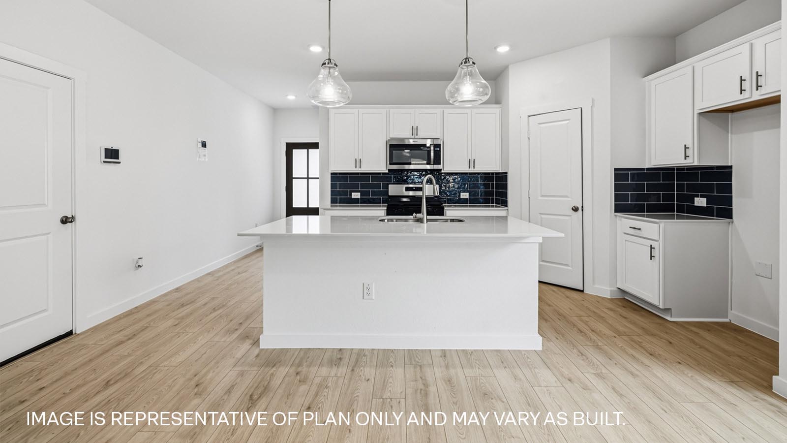 Open kitchen and living area with kitchen island.