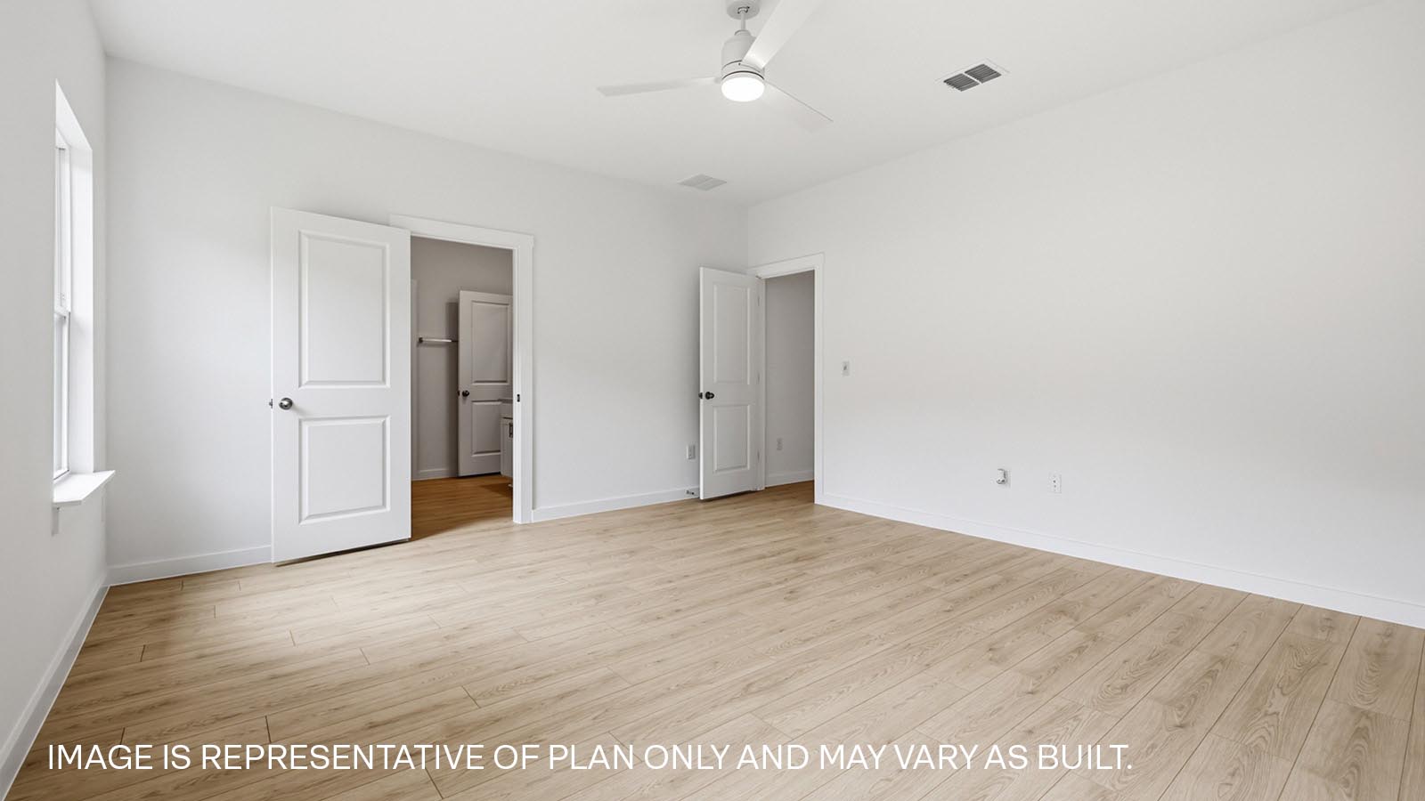 Premium laminate wood plank flooring in primary bedroom.