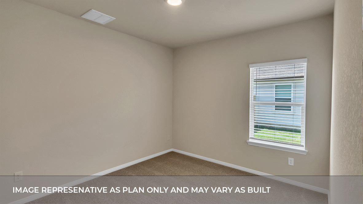 Bedroom with carpeted floors and large single window for natural light.