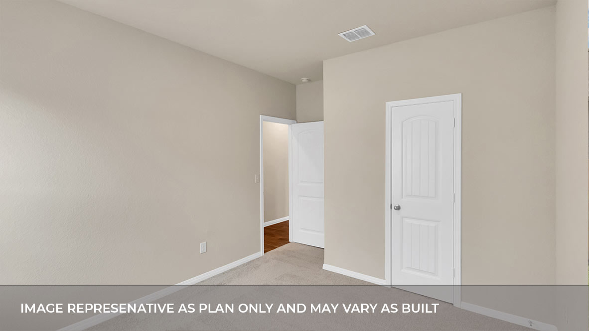 Bedroom with closet door and entry door.