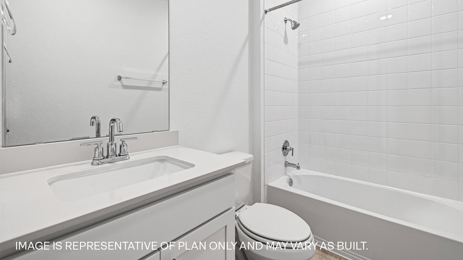 Secondary bathroom with tub and raised shower head.