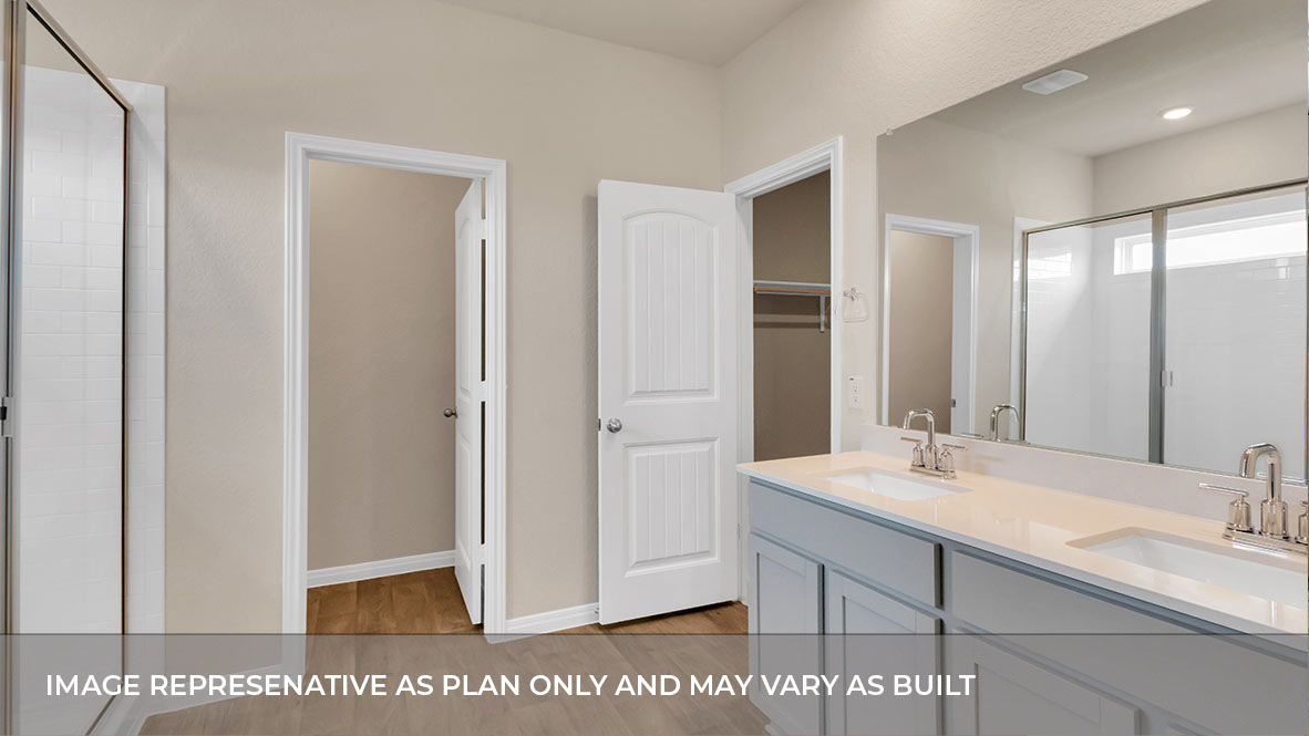 A modern bathroom featuring a double sink light gray vanity with light tan granite countertops and walk-in shower and with built in shelve with spacious walk in closet.