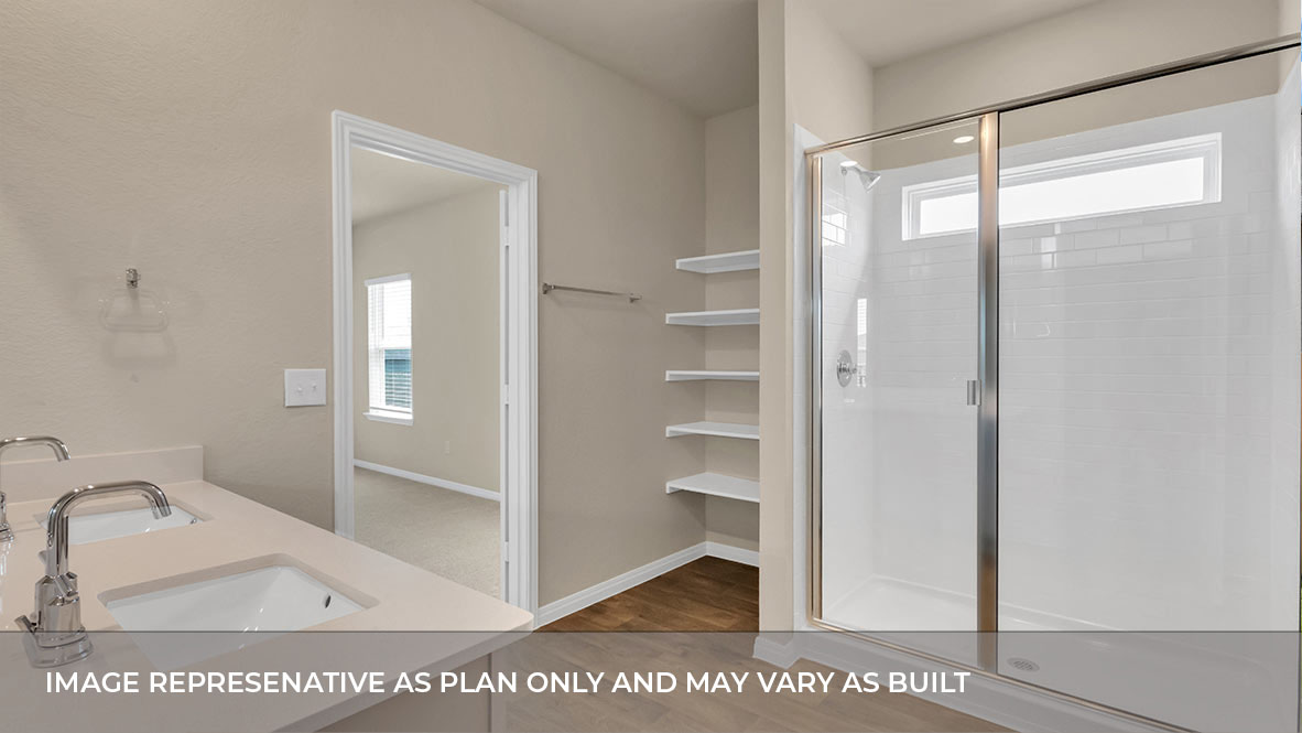 Primary bathroom featuring a double sink light gray vanity with light tan granite countertops and walk-in shower and with built in shelve with spacious walk in closet.