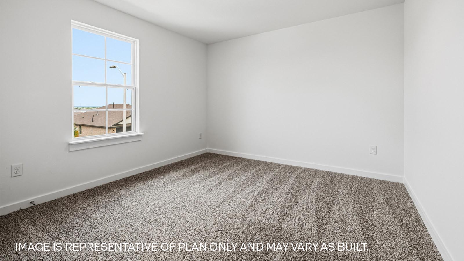 Bedroom 3 with carpeted flooring.