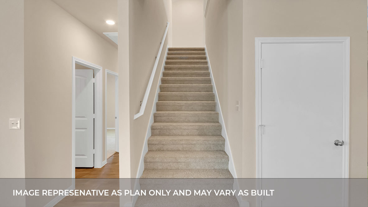 Stair to loft area with hallway to the left.