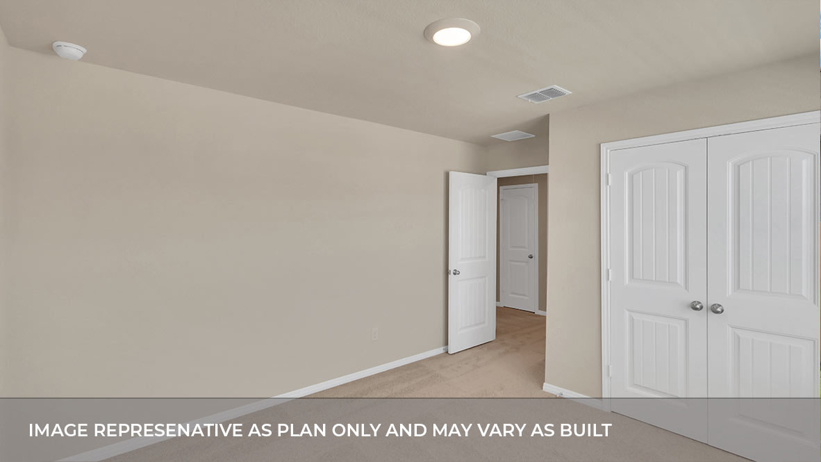 Bedroom with closet door and entry door.