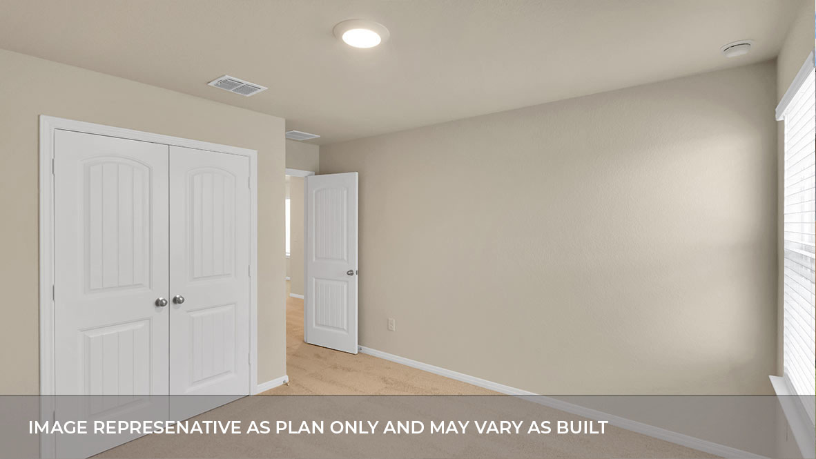 Bedroom with closet door and entry door.