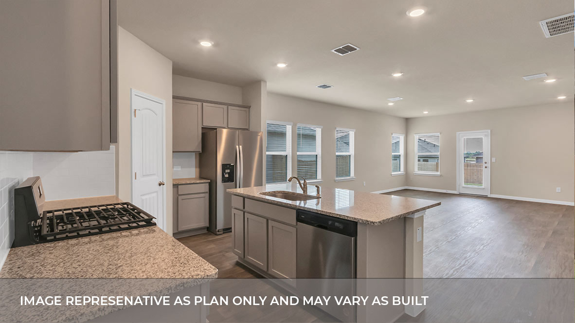 Open concept kitchen with large island with view of the living and and dining area.