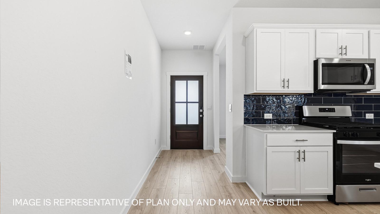 Entry way with view of mahogany wood front door.
