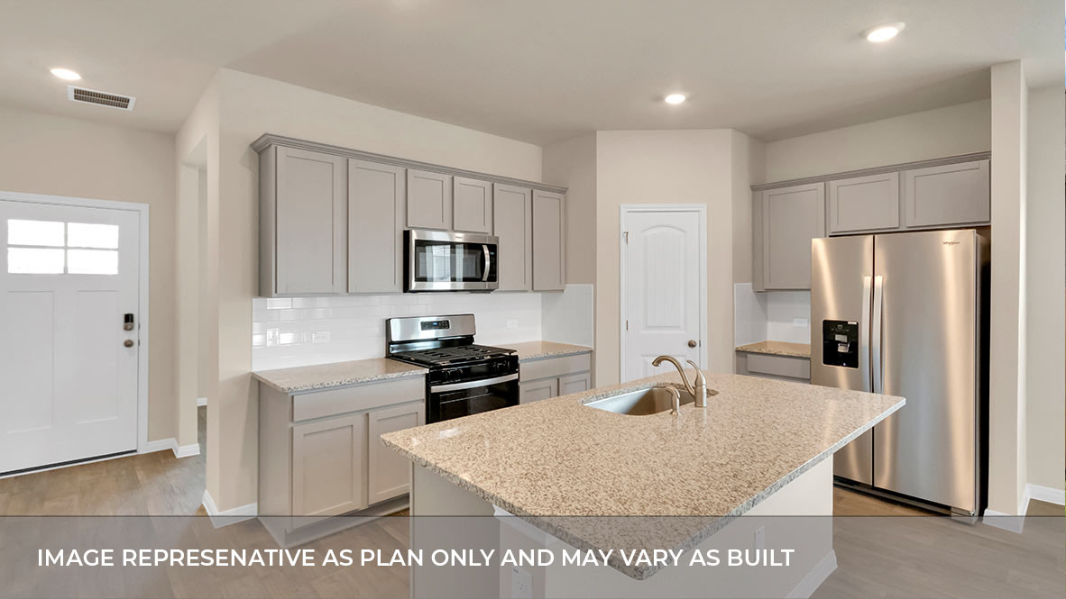 Large kitchen area with open concept view of foyer.