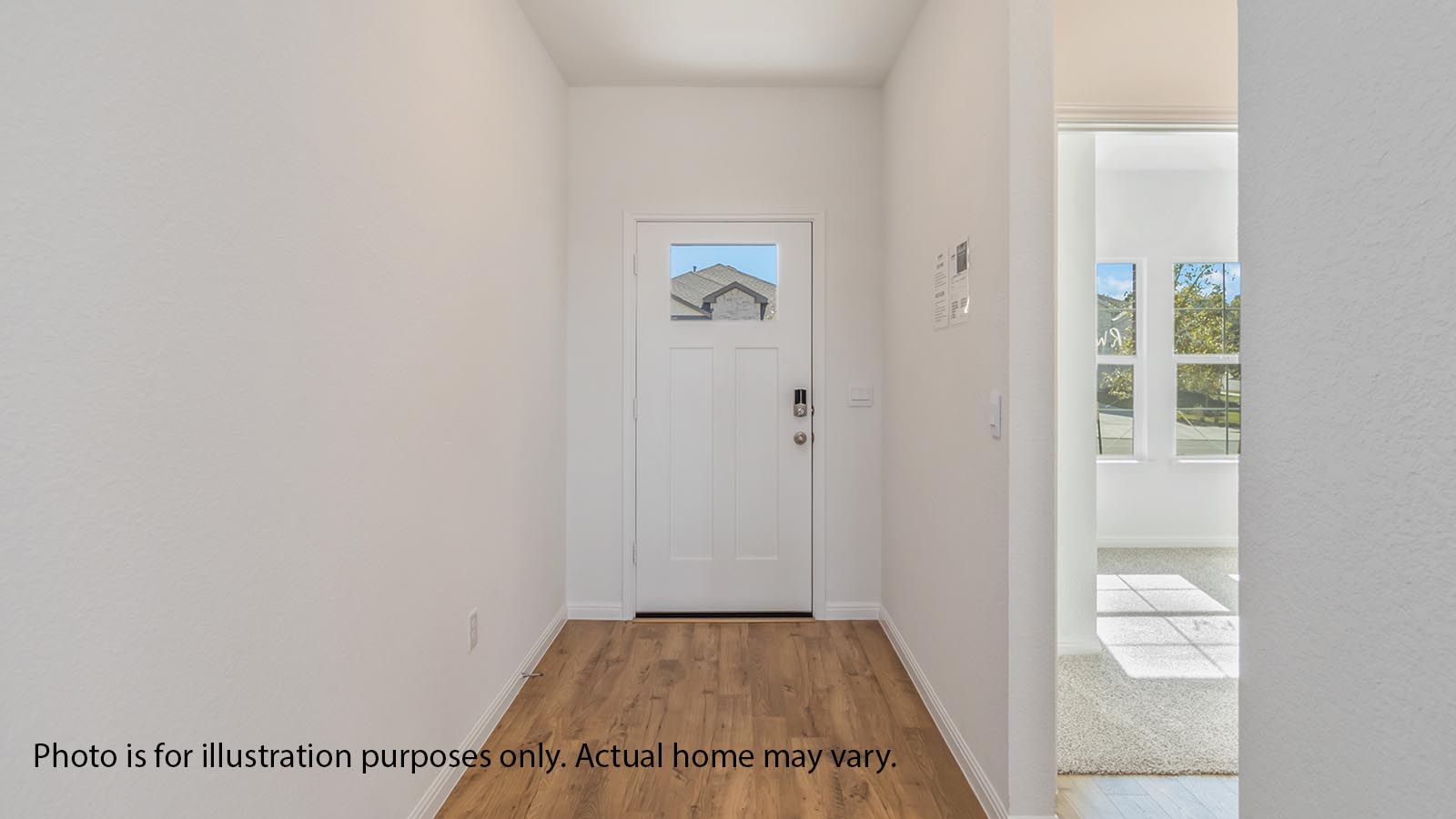 Front entryway with LVP floors and 7 foot door