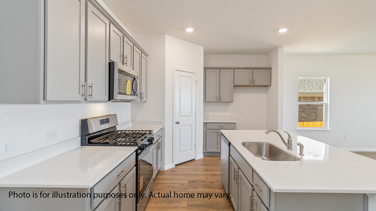 Kitchen with island, gray cabiets, LVP floors