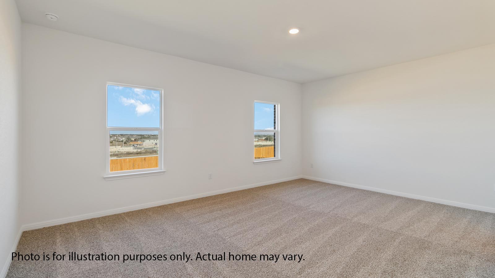 Primary bedrooom with carpet