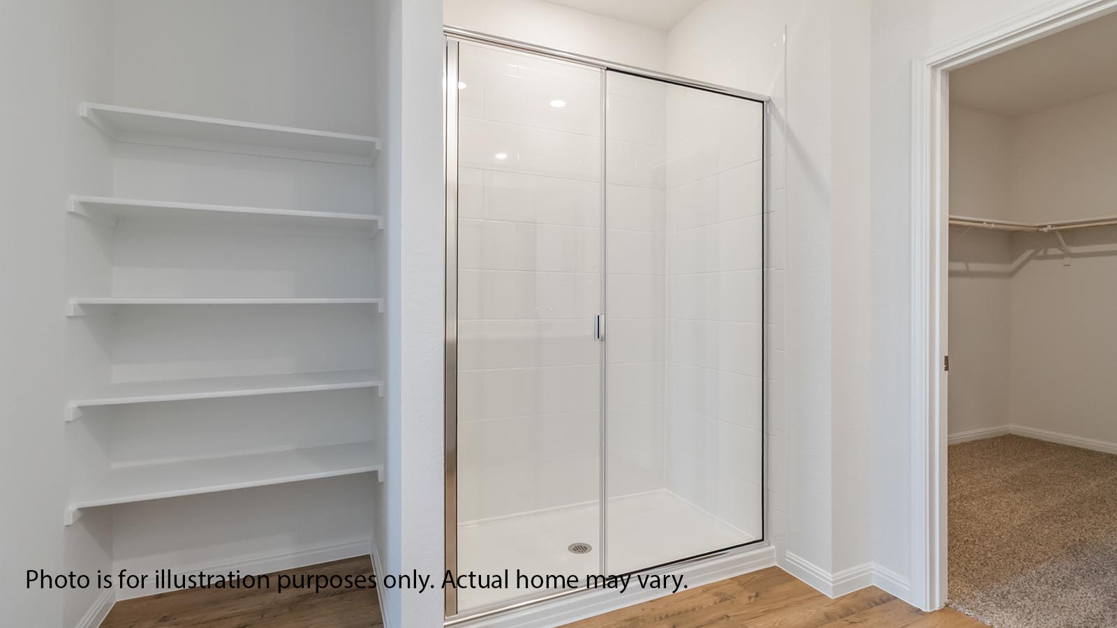 Primary bath with gray cabiets and dual sink and standing shower