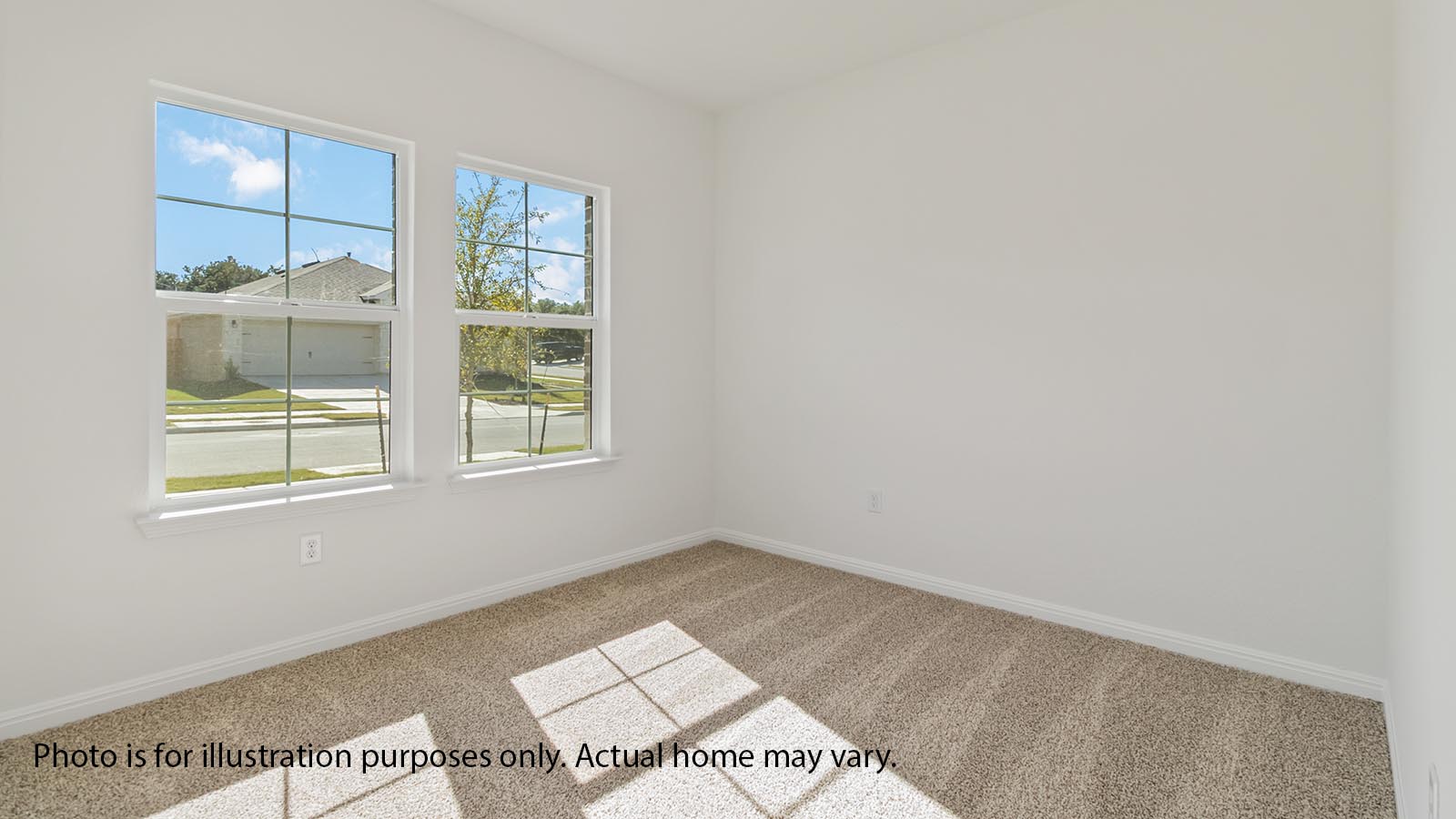 front downstairs secondary bedroom wiith carpet