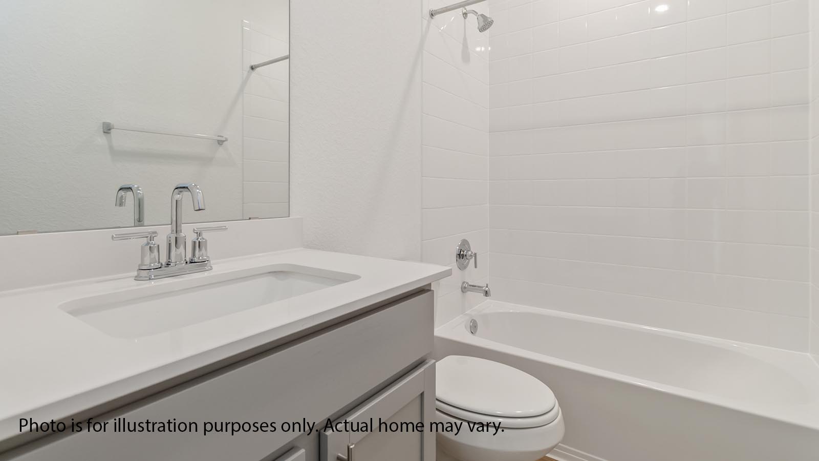 hallway bath with vanity and tub/shower combo