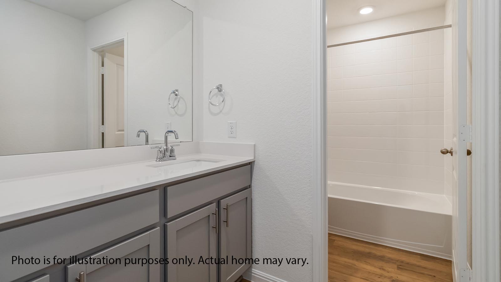 Upstaris bathroom with vanity and tub/shower combo