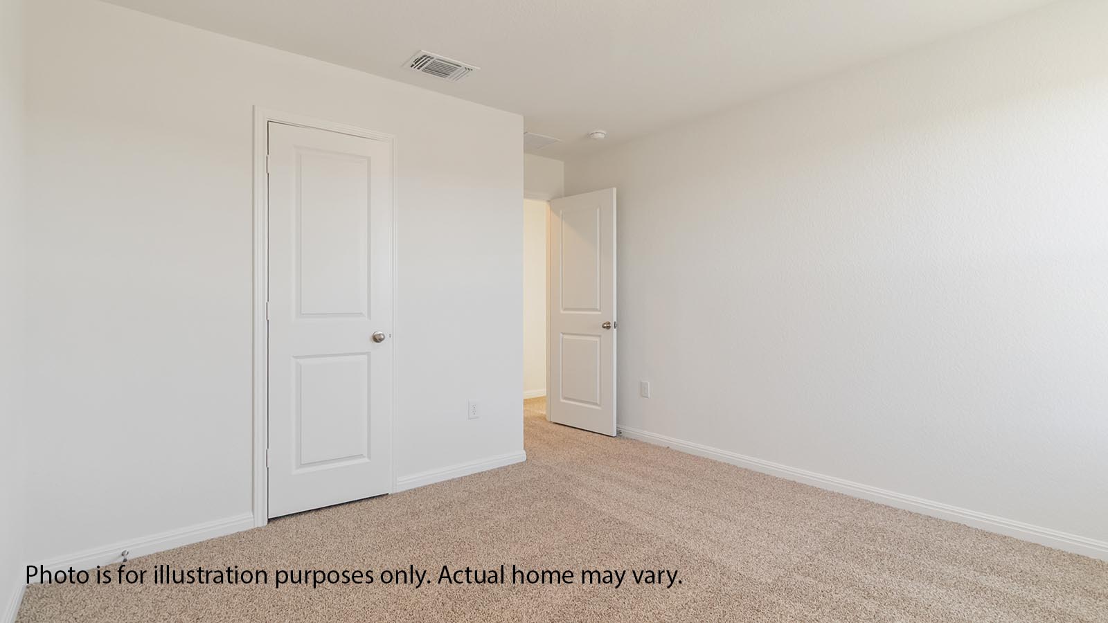 Upstairs secondary bedroom with carpet and closet