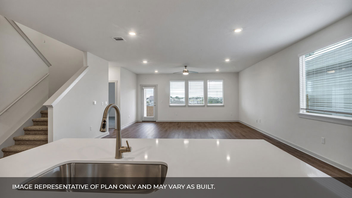 Beind kitchen island with view of the living and dining area.