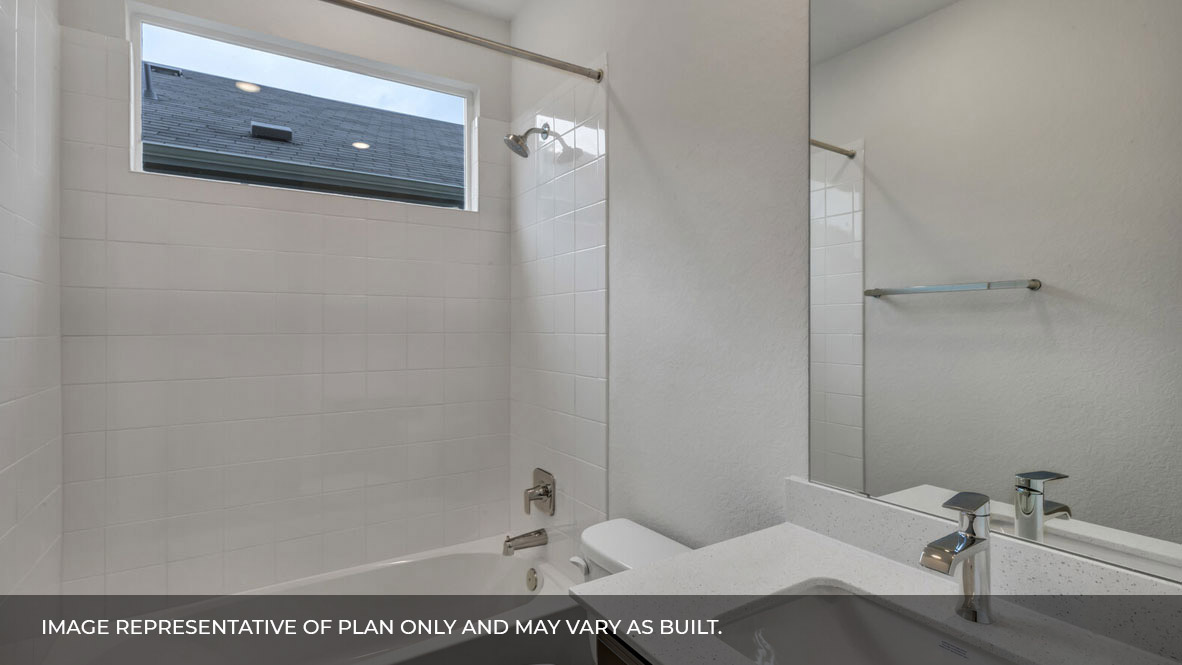 Bathroom with single sink white vanity and white granite tops with white tile shower and tub combo.