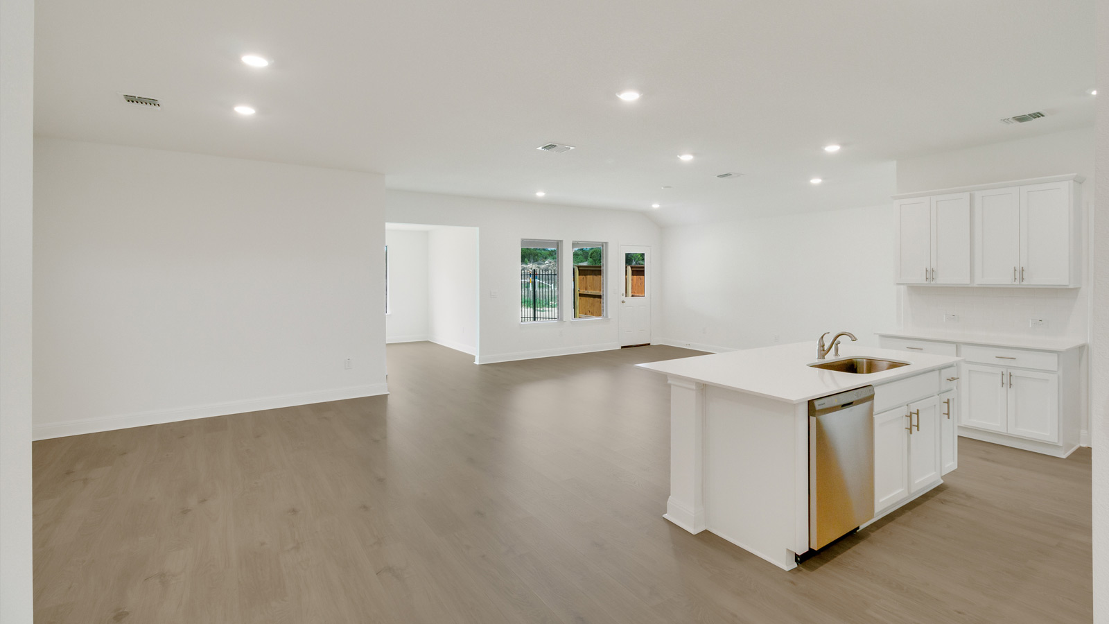 open concept living room next to the kitchen
