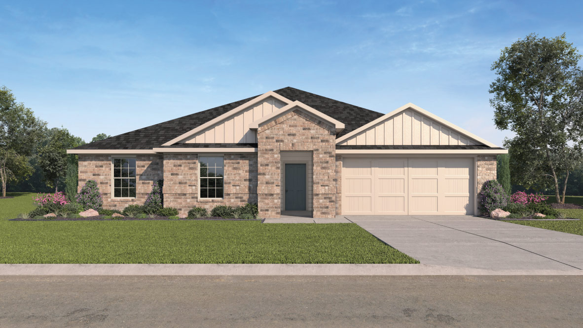 exterior of home featuring light colored brick and 2 car garage
