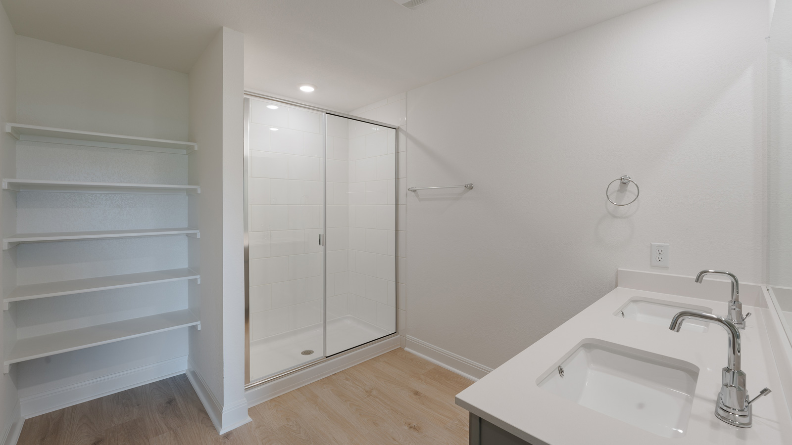 Bathroom 1 with double vanity sink and walk-in shower.