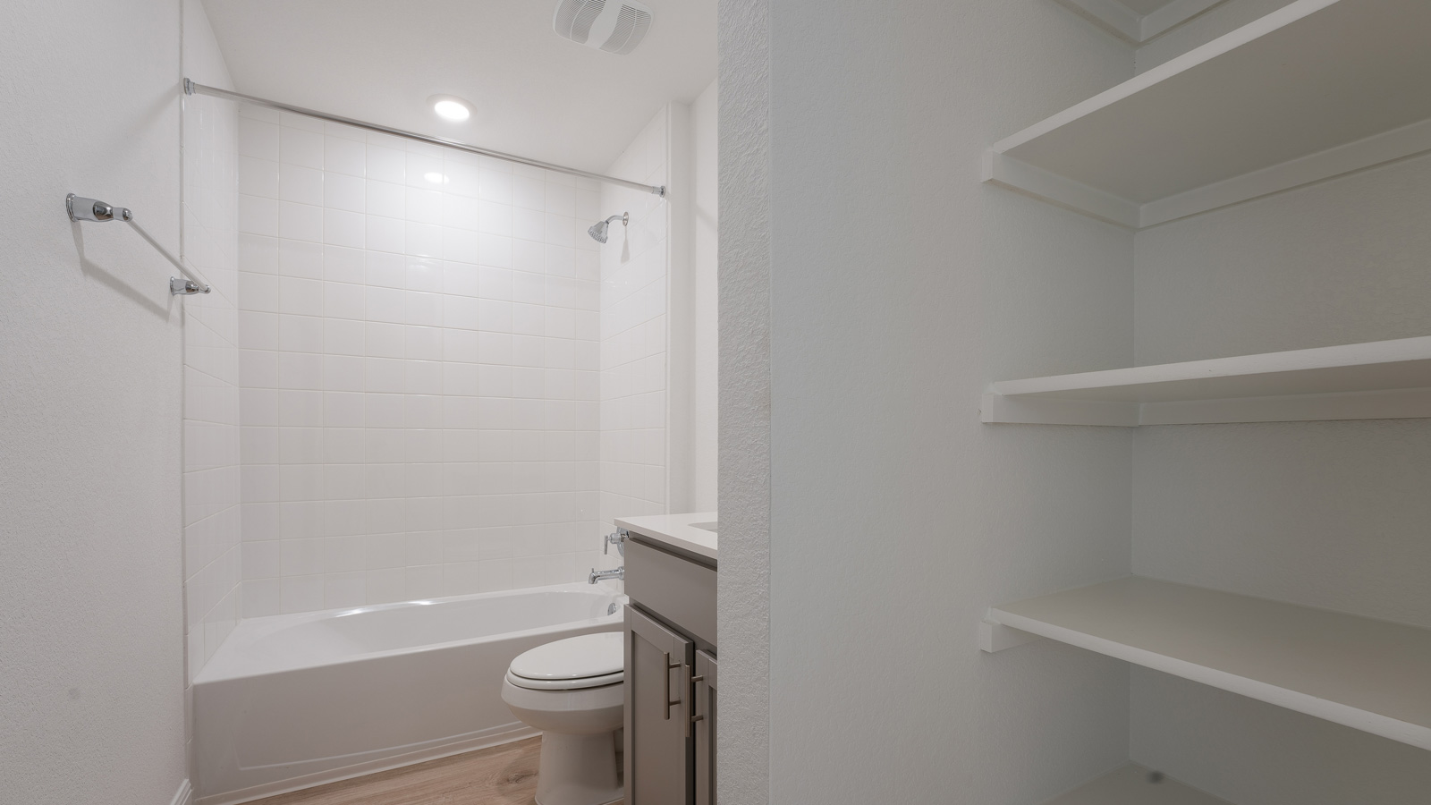 Bathroom 2 with single vanity sink and bathtub.