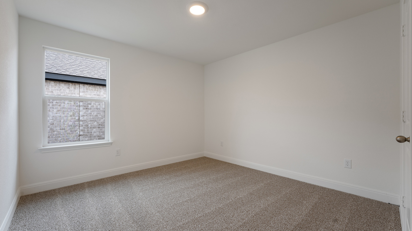 Bedroom 3 with carpeted flooring.