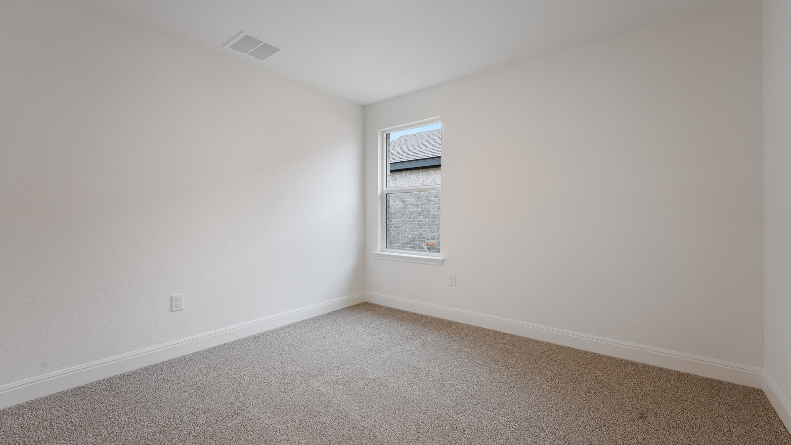 Bedroom 4 with carpeted flooring.