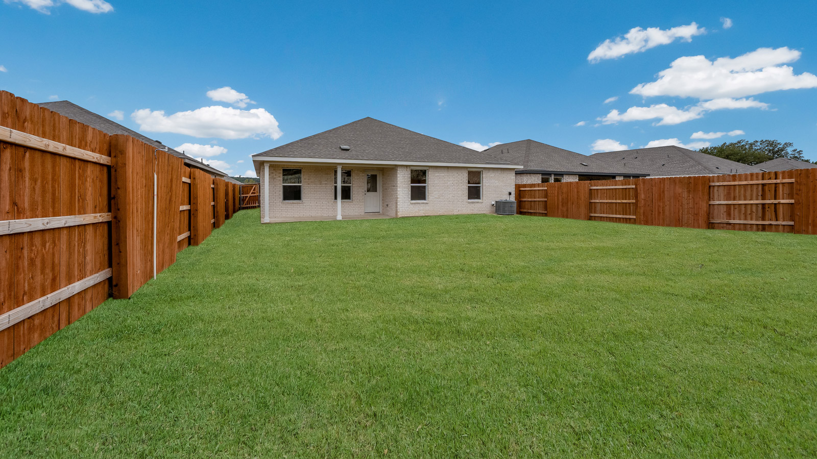 Large backyard of 120 Bruin Paw Drive at Riverview in Georgetown, TX.