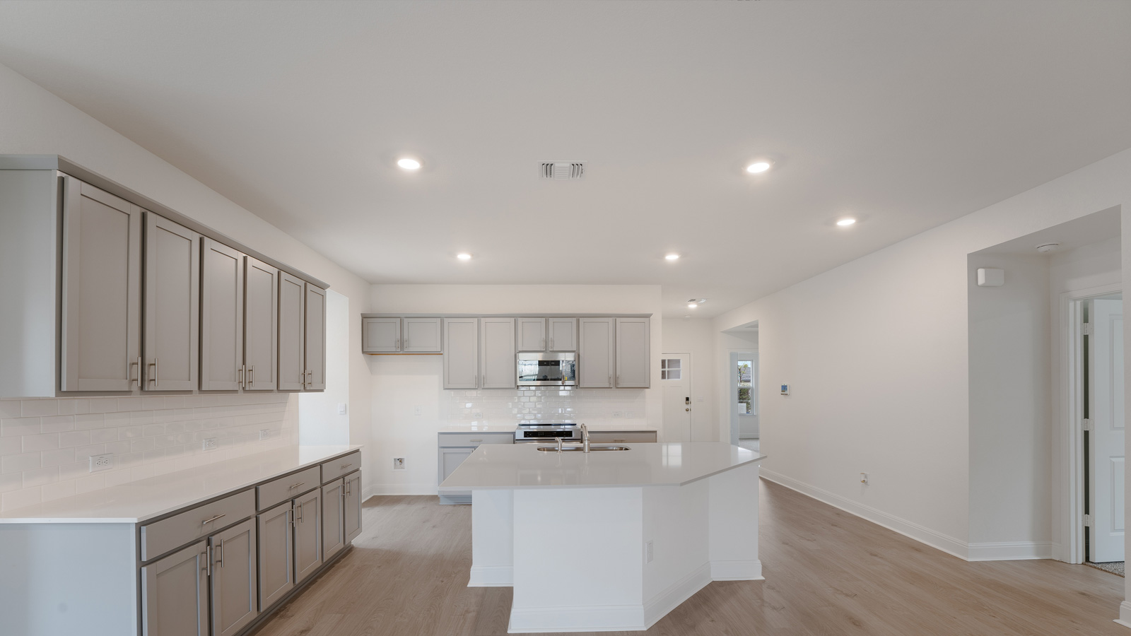 Cabinets in kitchen offer plenty of storage space.