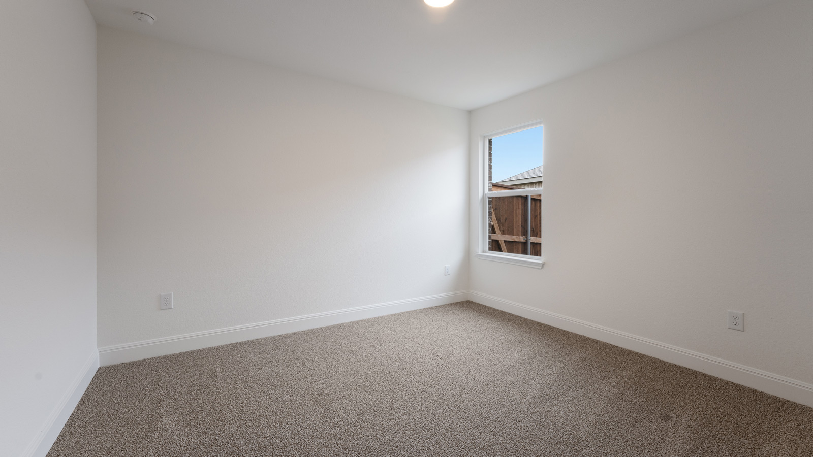 Bedroom 4 with carpeted floors and a storage closet.