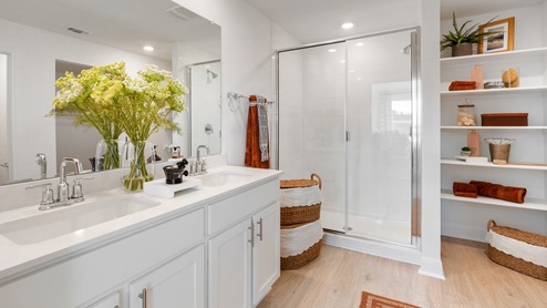Bathroom 1 with double vanity sink and walk-in shower.