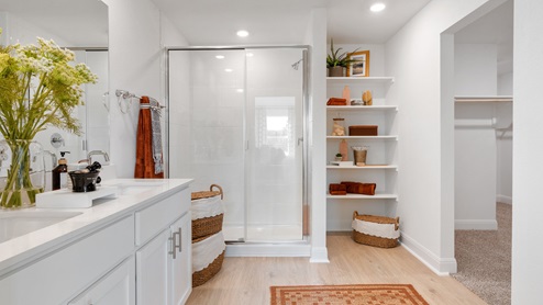 Bathroom 1 with double vanity sink and walk-in shower.