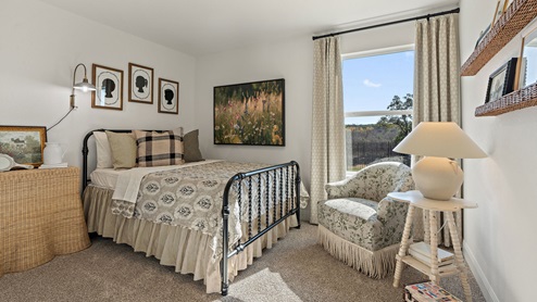 Bedroom 2 with carpeted floors.