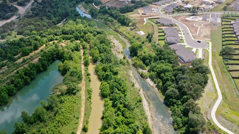 Drone view of San Gabriel River located south of community.