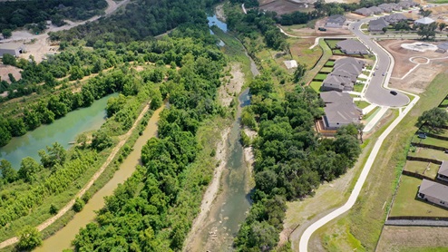 Drone view of San Gabriel River located south of community.