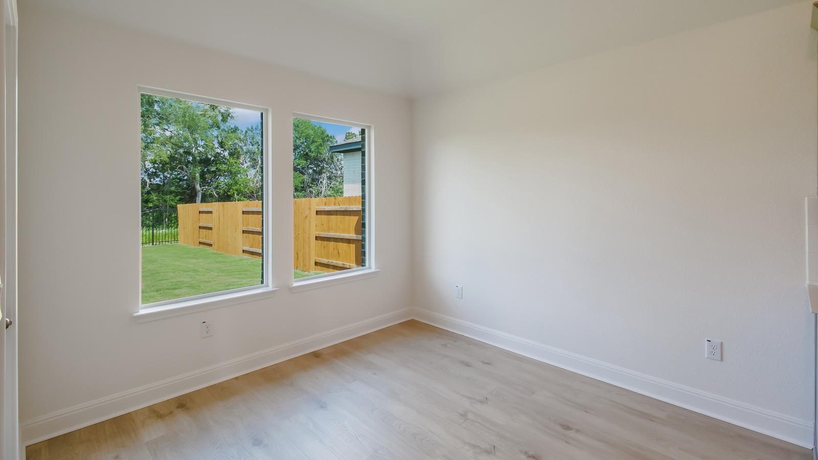 Dining area off the kitchen with two windows.