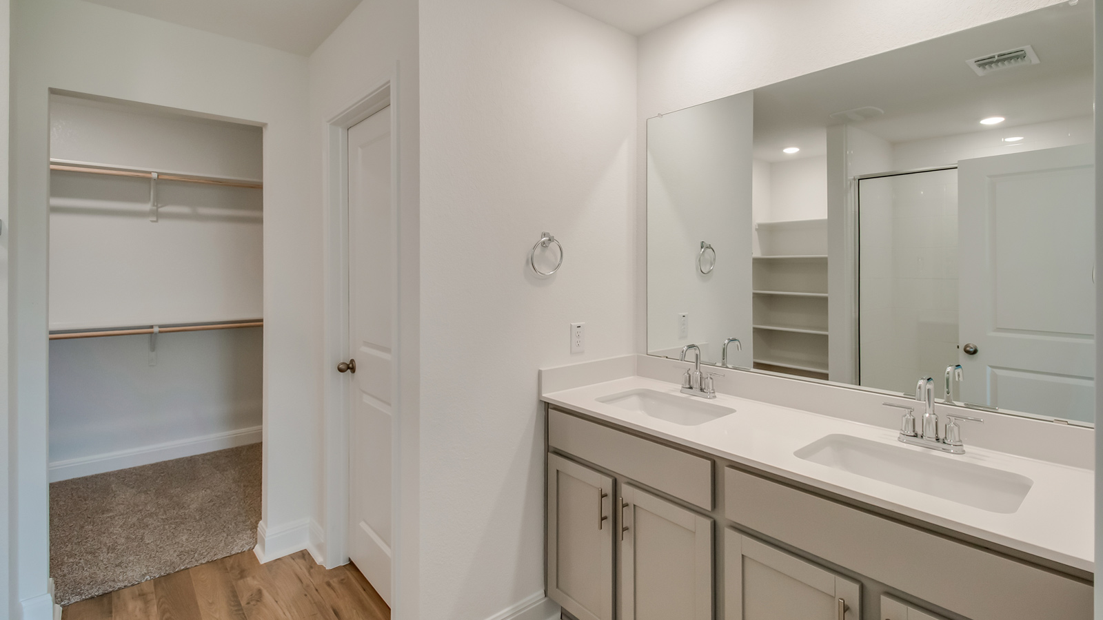 Bathroom 1 with double vanity sink and walk-in shower.