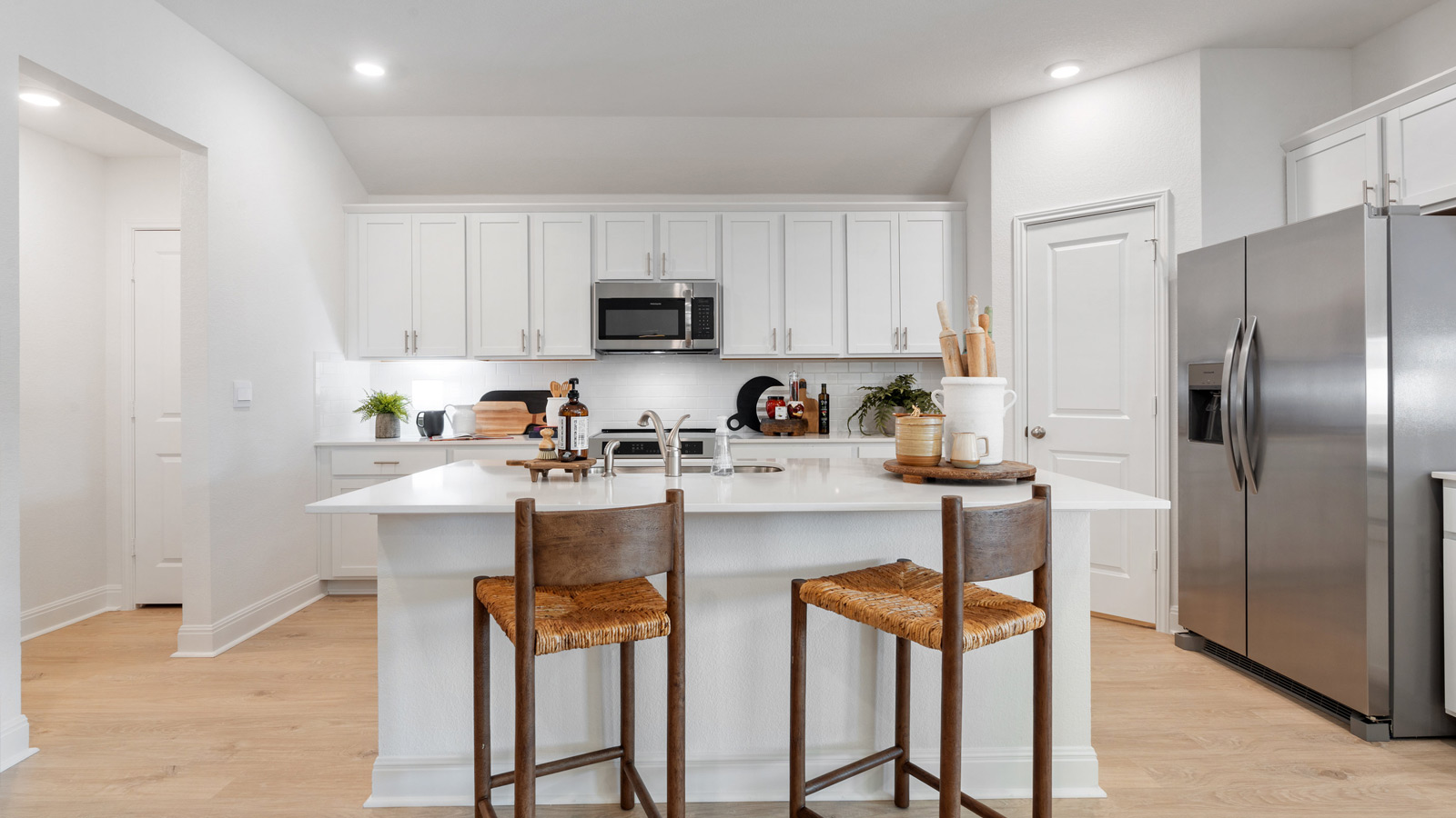Kitchen with large kitchen island and tile backsplash.